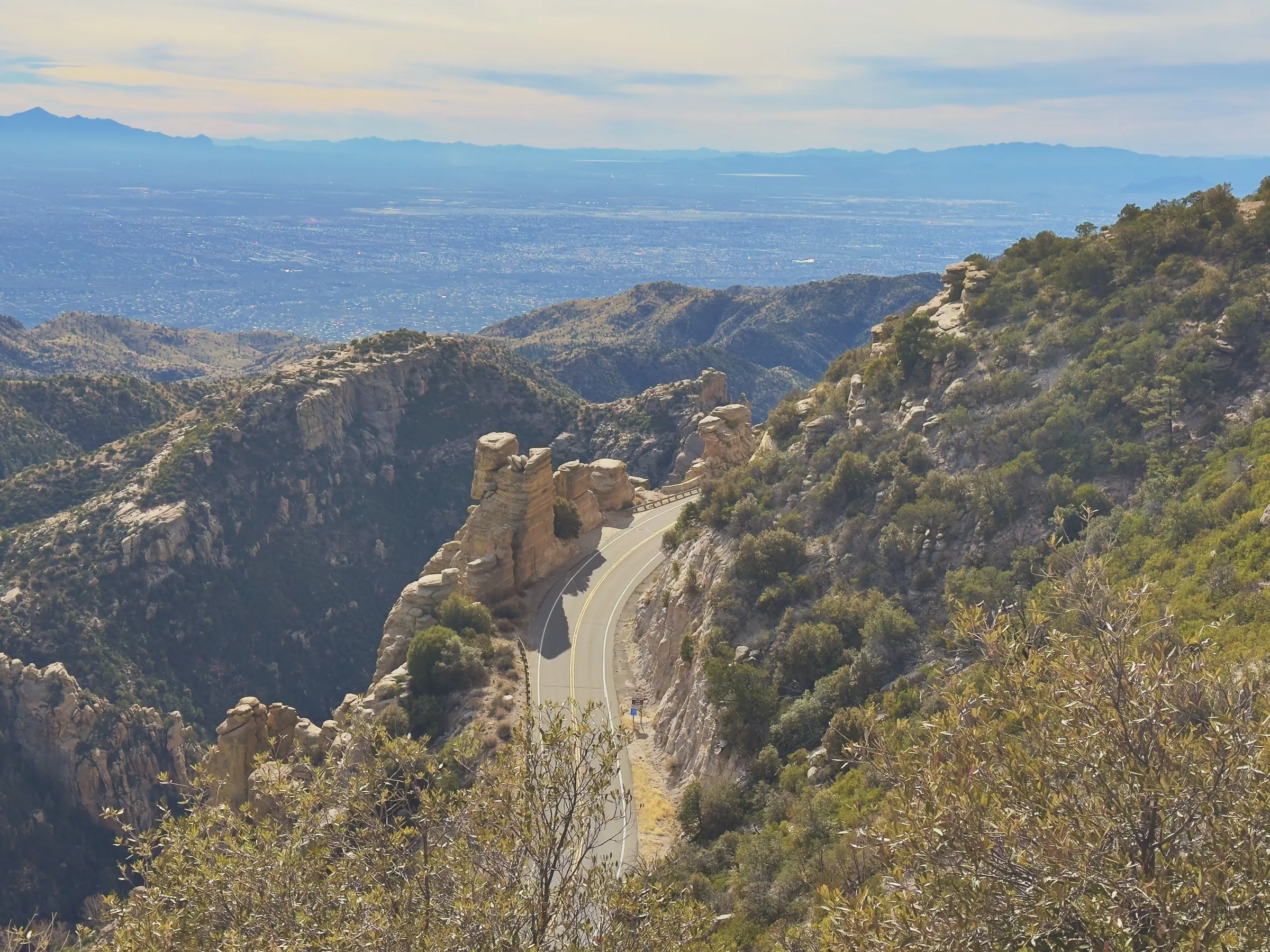 A winding mountain road high above the desert floor