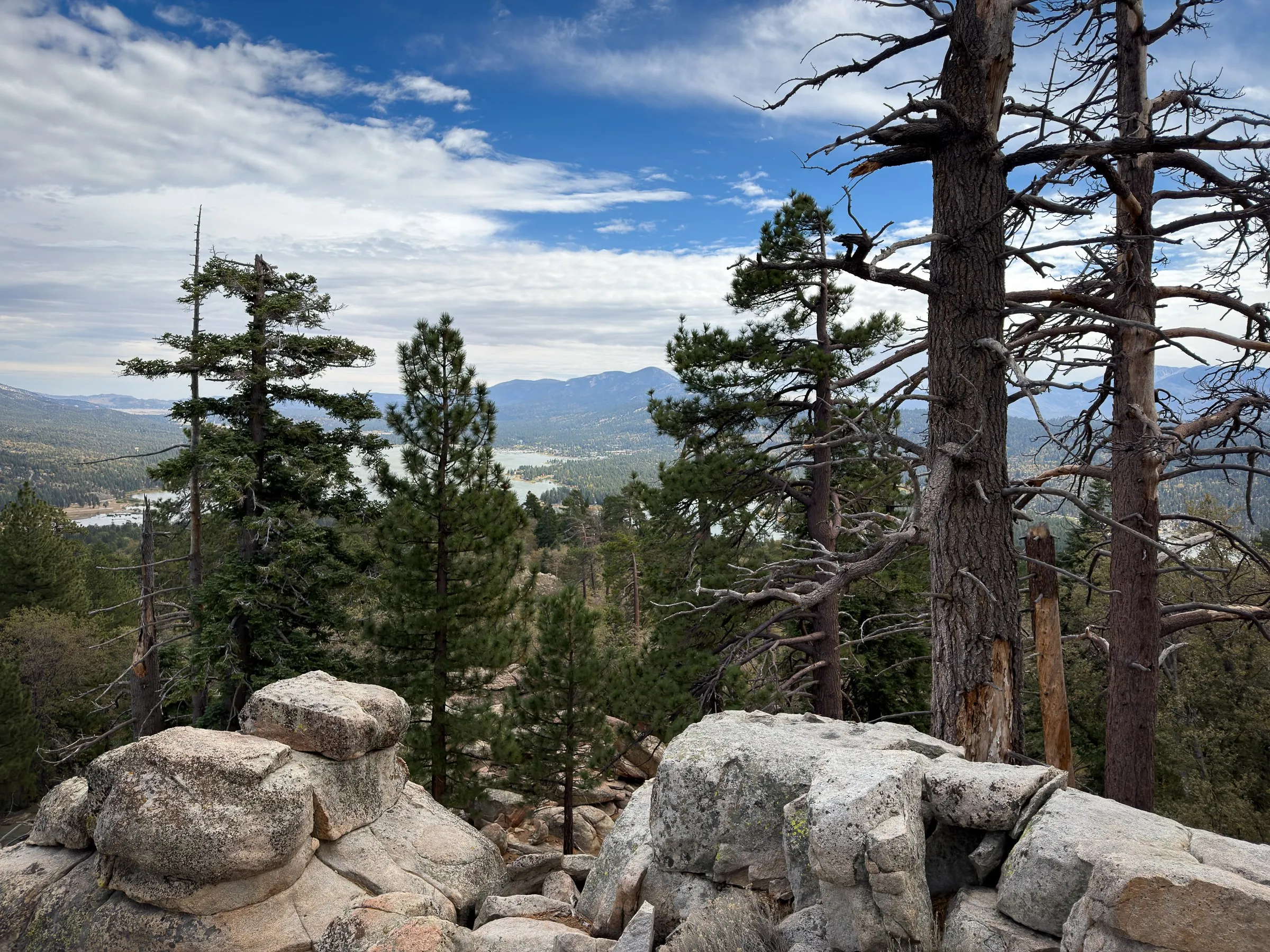 The view from the top: pines and granite in front, Big Bear Lake and the mountains beyond